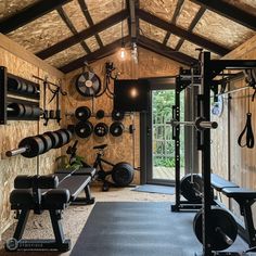 a home gym with lots of exercise equipment