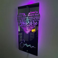 a bathroom mirror that has some writing on it