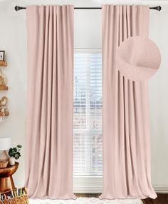 the pink curtains in this room are ready to be hung