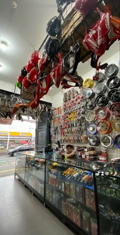 a store filled with lots of assorted items and hanging from the ceiling above it