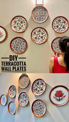 there are many plates on the wall and one girl is looking at her cell phone