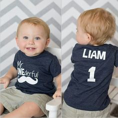 a toddler sitting on a white chair wearing a t - shirt that says, my onederful is 1