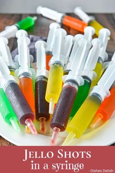 jello shots in a syringe on a plate with text overlay that reads jello shots in a syringe