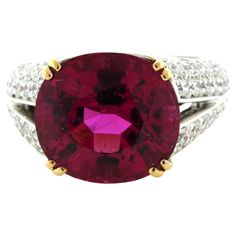 Simply stunning! The ring features an amazing 9.42 carat rubellite tourmaline with the most bright vivid and vibrant color we have seen in a long time! It is a rich pinkish-red color that will make you smile and feel warm inside. It is complemented by 2.46 carats of pave-set diamonds set around the ring adding brilliance and sparkle to the piece. Made in platinum with 18k yellow gold prongs holding the tourmaline. Ring Size 7 Weight: 11.4 grams Bellari Ring, Diamond Gold Ring, Cowry Shell, Rubellite Tourmaline, Platinum Diamond Rings, Rose Rouge, Diamond Gold, Platinum Ring, Gold Diamond Rings