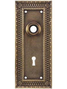 an antique brass door with a decorative design on the front and side panel, featuring a circular