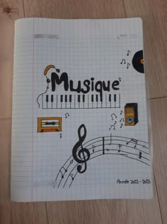 an open notebook with music notes and musical symbols