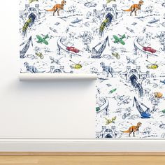 an animal themed wallpaper in a room with white walls and wood flooring,