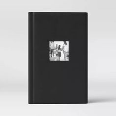 a black book with an image of people on it