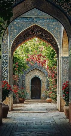 an archway with flowers and potted plants on either side