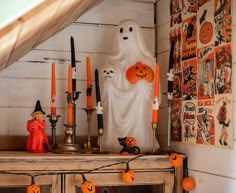 halloween decorations are displayed on an old dresser