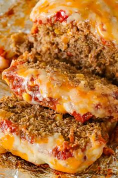 meatloaf stuffed with cheese and sauce on foil