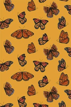 an orange and black butterfly pattern on a yellow background