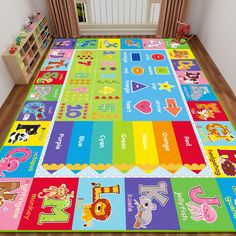 a child's play mat with many different colors and numbers on it in front of a window