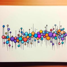 an abstract painting on white paper with colorful balls and lines in the center, as well as dots