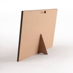 an open cardboard folder with a brown triangle on the front and bottom, standing upright against a white background