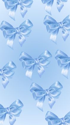 a blue background with many large bows on it's sides and one big bow in the middle