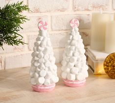 two christmas trees made out of marshmallows on a table