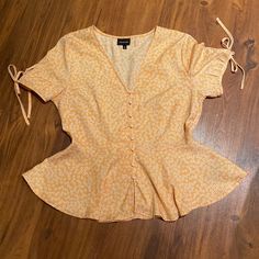 So Cute! Nwot Love The Peplum Look. Very Flattering Button Down Open To All Offers! Cute Yellow Spring Blouse, Cute Yellow Fitted Blouse, Fitted Yellow Tops With Buttons, Yellow V-neck Top With Button Closure, Yellow V-neck Blouse With Buttons, Trendy Yellow Blouse With Buttons, Yellow Button Blouse For Day Out, Floral Peplum, Tie Sleeve