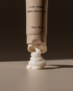 a tube of cream sitting on top of a table