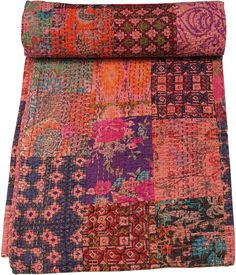 an old patchwork rug with many different colors and patterns