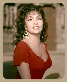 an old photo of a woman in a red dress