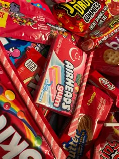 a pile of assorted candy bars and candies