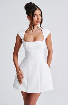 Lena is a chic and timeless addition to your wardrobe. The mini dress is crafted in our luxe crepe fabric with cap sleeves, square neckline and seam detailing to the body for a contoured shape. The dress cinches at the waist for the silhouette of dreams. Wear with soft waves and neutral heeled mules for a chic finish. Colour: Ivory. Premium non-stretch crepe. Fully lined. Square neck. Short cap sleeves. Bubble shaped skirt. Cinches at the waist. Seam detailing to body. Invisible zipper fastening Streetwear Caps, Tank Dresses, Streetwear Mode, Elegant Party Dresses, Maxi Dress Sale, Sparkle Dress, Mini Dresses For Women, Basic Dress, Dresses By Length