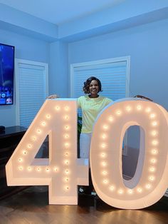 a woman standing in front of the number forty four