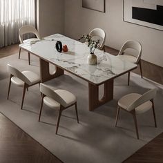 a dining room table with chairs around it