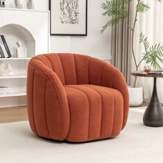 an orange chair sitting on top of a white rug