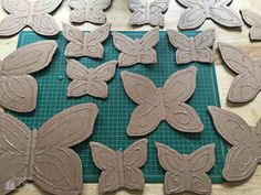 the cookies are shaped like butterflies and ready to be cut into smaller ones for decoration