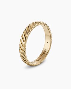 a yellow gold wedding band with twisted design