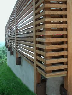 the side of a building with wooden slats on it