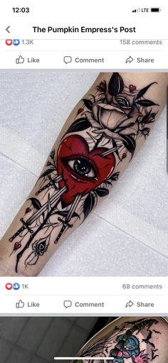 a tattoo with an eye and flowers on the arm, next to a cell phone