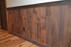 a wood paneled wall in an empty room