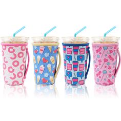 three different colored cups with straws in them