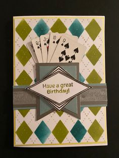 a card with playing cards on it and the words have a great birthday written in white