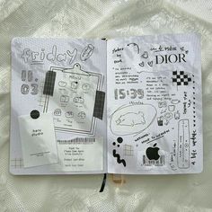 an open notebook with drawings on it