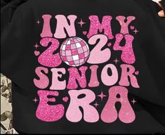 Introducing the Senior 2024 "Era" Tshirt. Celebrate your upcoming graduation in style with this exclusive shirt. Made with high-quality material for ultimate comfort, this shirt boasts a modern and trendy design. Show off your senior class pride and commemorate this milestone with the Senior 2024 "Era" Tshirt. This shirt is a front and back design, it has a pocket design that can be personalized with your graduates name or nickname I WILL RWACH PUT TO CONFIRM GRADUATES NAME ON TSHIRT OR YOU CAN EMAIL TO WHISKEYBLOSSOMDESIGNS@myyahoo.com Senior Class Shirts Design, Senior Tshirts, Seniors 2024, 2024 Era, Senior Class Shirts, Senior Sweatshirts, Back Design, Design Show, Pocket Design