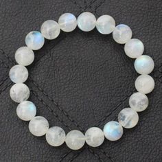 "Material- white rainbow Gemstone Color- White bracelet length- 7-7.5inch beads size- 4,6,8,mm Shape- Round About this item The bracelet shown is 7-7.5\" size which fits an average wrist but if you have a different wrist size you can message us we will custom make your order This is a stretch fit bracelet, allowing for easy on-off fitment over the hand Sell Unit 1 bracelet, beads size 4,6,8, mm fully stretchable bracelet Direct from Jaipur-India, Best Price, Hand select, Nice Quality Size, Weight & Colour are approximate and may slightly vary Stone: Natural moonstone (no dyed, no color enhanced, Natural crystal/gemstone Moonstone is a stone of inner growth and strength; It is believed to help soothe emotional instability and stress, and stabilize the emotions, providing calmness; Moonstone Moonstone Gemstone Beaded Bracelet As Gift, Bohemian Round Moonstone Crystal Bracelet, Hand-strung Moonstone Beaded Bracelets For Meditation, Adjustable Moonstone Jewelry With Round Beads, Bohemian Moonstone Bracelets With Round Beads, Spiritual Moonstone Beaded Bracelets With Natural Stones, Spiritual Hand-strung Moonstone Bracelets, Adjustable Moonstone Bracelet With Gemstone Beads, Adjustable Moonstone Gemstone Bead Bracelet