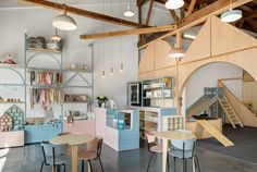 the interior of a children's playroom with toys and furniture