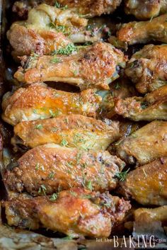 baked chicken wings with herbs in a baking dish