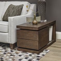 a living room scene with focus on the end table and sofa in the back ground