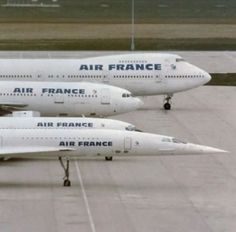 three air france planes are parked on the tarmac