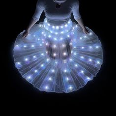 Mesmerize your audience with this dazzling LED light up belly dance skirt! This stunning skirt features layers of flowing fabric adorned with bright  LEDs that create a captivating light show with every movement. Perfect for belly dancing, performances, raves, festivals, or any event where you want to shine. Material: Veil, Synthetic fabric, LED Size: - Waist circumference: 65-95cm - Skirt length: 85cm Features: - Vibrant LEDs - Flowing fabric - Comfortable fit Please Note: Due to variations in Led Skirt, Rave Skirt, Belly Dance Skirt, Festival Skirt, Performance Costume, Festival Skirts, Flowing Fabric, Dance Skirt, Belly Dancing