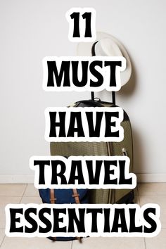 the words 11 must have travel essentials written in black on top of a piece of luggage