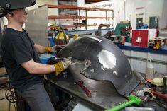 a man working on a large metal object