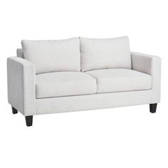 a white couch with two pillows on it