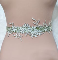 Length: about 100 inches (250 centimeters) Width: 1-2 inches (2.5 -5 centimeters) Introducing our Handmade Gold Flower Embroidery Lace Sash Belt, a stunning accessory that exudes elegance and charm. This meticulously crafted sash features a beautiful old gold beaded flower lace design, complemented by a champagne satin ribbon measuring 2 cm in width. Versatility is key with this piece, as it can be styled as a sash or transformed into a gorgeous headband. Belt For Wedding Dress, Epic Costumes, Lace Belt, Floral Sash, Lace Sash, Sage Wedding, Wedding Belt, Wedding Sash Belt, Belt Gold