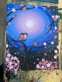 an acrylic painting of a tree with pink flowers and butterflies in the night sky